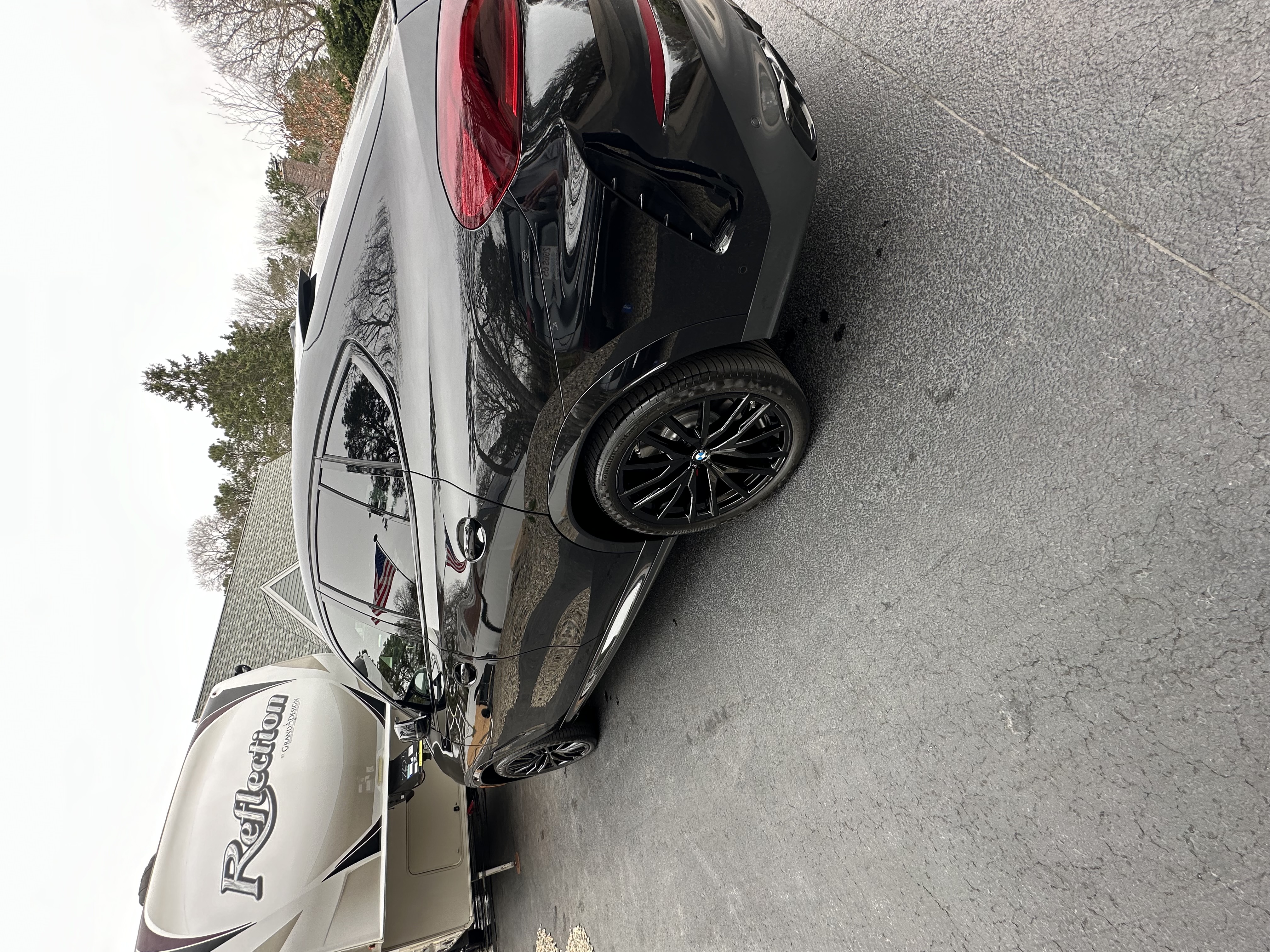 BMW next to RV at Auto Spa — full exterior detail