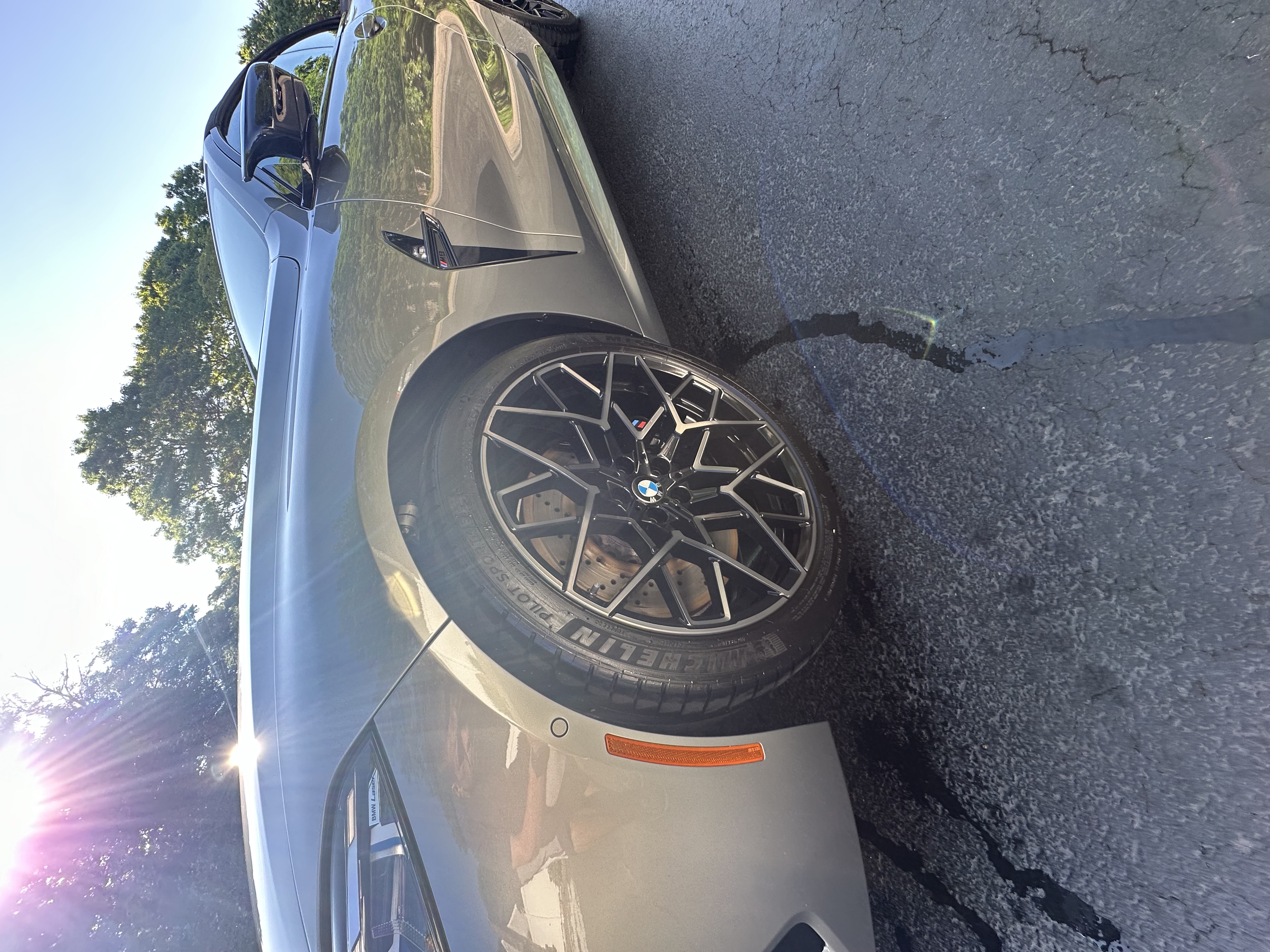 BMW M car wheel and paint detail — mirror finish